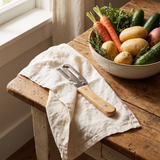 Castmoor wood handle peeler on a linen towel
